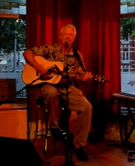Charlie performing at an open mic